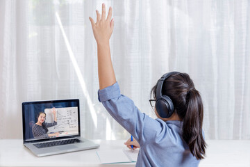 Asian little girl student learning via internet online class from school teacher duling covid-19 outbreak. Man teaching math by whiteboard. Homeschool learn from home concept