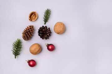 Christmas Background with Red Christmas Balls Fir and Nuts on Blue Background on Blue Background...