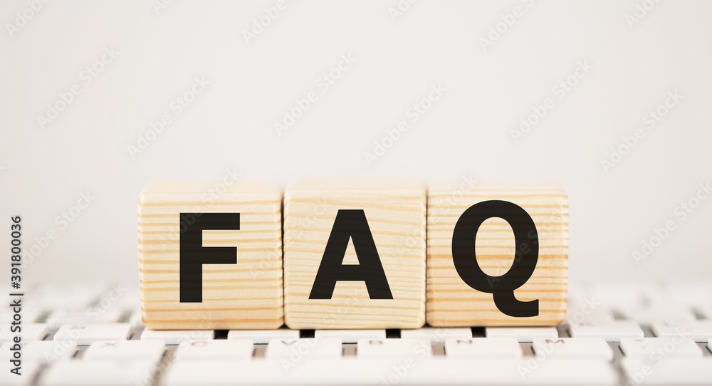 Poster faq on black block with keyboard background.