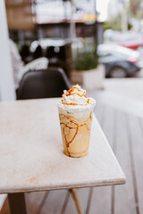 A single caramel frappe on a table
