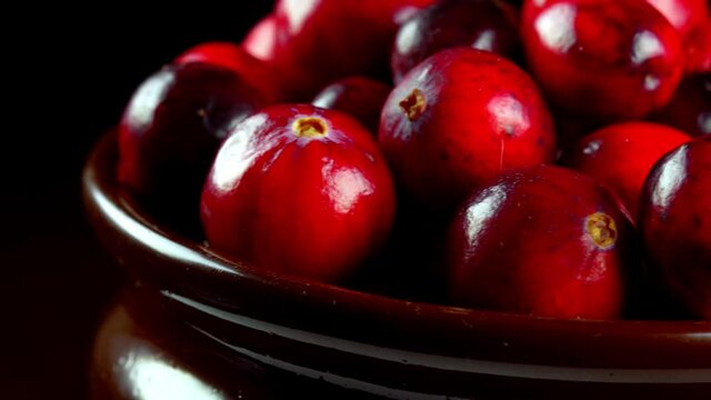 Lot of fresh ripe cranberries in pot.