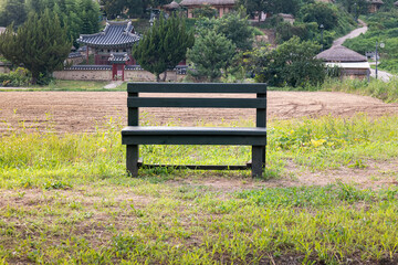 A wooden bench at the entrance of Yangdong Village, a UNESCO World Heritage Site in Gyeongju, South Korea