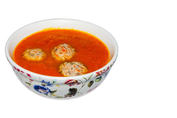 grated pumpkin, ginger and carrot soup on a white background