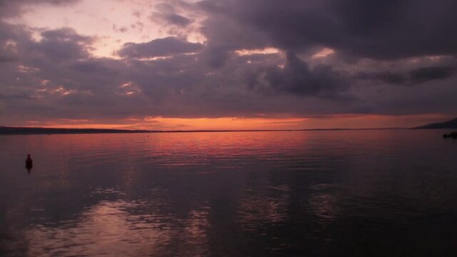 Seascape at sunset, beautiful sunset sky, sea and orange sun