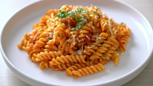 spiral or spirali pasta with tomato sauce and cheese - Italian food style