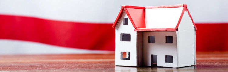 house model near red stripped flag on blurred background, banner