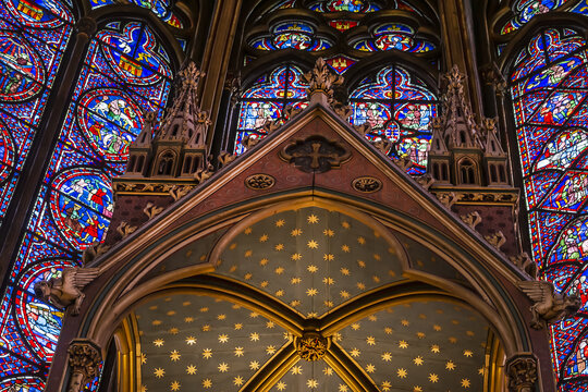 Interior of medieval Paris Holy Chapel (Sainte Chapelle, 1248) with 15 windows, each 15 metres high of colorful stained glass. Ile de la Cite in Paris. Paris, France - September 4, 2016.