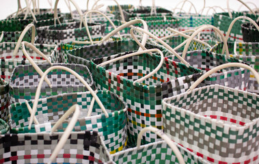 Colorful plastic baskets. Handmade containers.