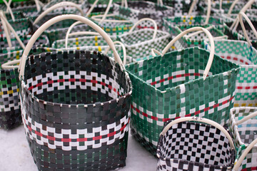 Colorful plastic baskets. Handmade containers.