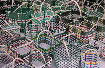 Colorful plastic baskets. Handmade containers.