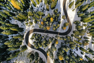 Aerial drone view of windy road during winter