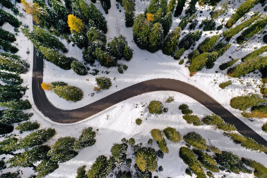 Aerial drone view of windy road during winter
