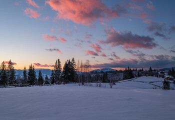 Winter sunset alpine tops  view from mountain village. Picturesque seasonal, nature and countryside beauty concept scene.