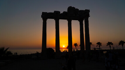 silhouette of the temple of apollo by the sea at sunset. side in turkey