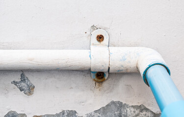 PVC pipe with the metal clamp for water supply system.