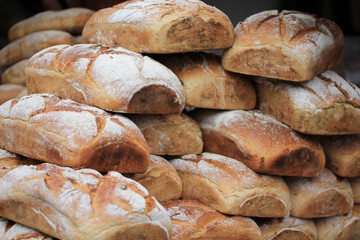 a mountain of loaves of bread