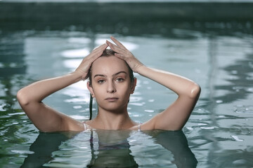 Woman chilling in pool water
