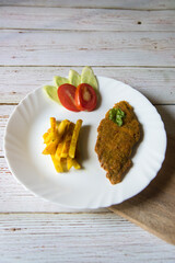 View from top of fried fish and chips in a plate
