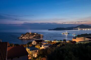 Fototapeta premium sunset over the mediterranean sea in Montenegro. Night view panorama island Sveti Stefan. 