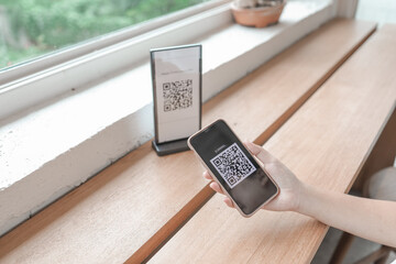 E wallet Qr code payment. Woman scanning QR code online shopping cashless technology concept