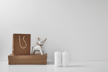 Porcelain figurine of a New Year's deer and New Year's, festive decor. Copy space, mock up.