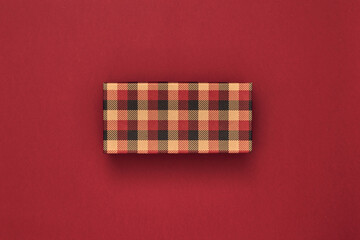 Fototapeta na wymiar Gift boxes and gift bag on a red background. Black Friday. Copy space, flat lay, mock up, top view