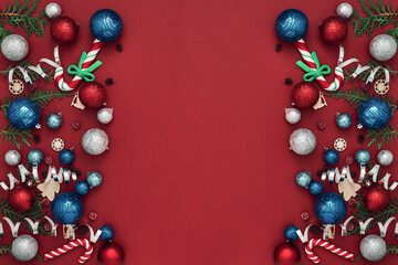 New Year's, festive decor on a red background. Copy space, flat lay, mock up, top view