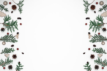 Thuja branches, spruce and New Year's decor. Copy space, flat lay, mock up, top view.