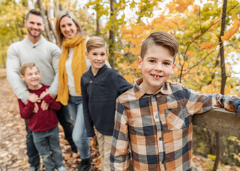 Family Group having fun Outdoors In Autumn Landscape