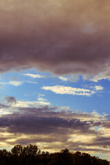 Sky with some dramatic clouds and vibrant colors at golden hour