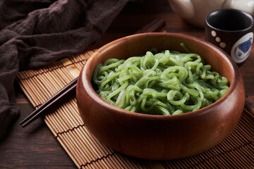 green shirataki noodle (konjac) in wooden bowl background. Japanese food