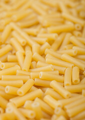 Fresh raw classic macaroni pasta ias texture background.