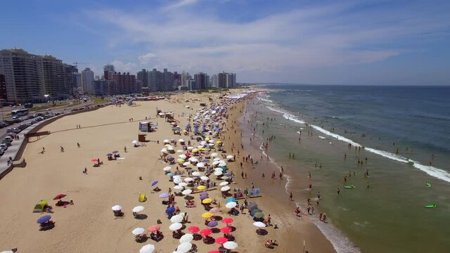 Aerial view of people enjoying the summer at famous Playa Brava beach in Punta del Este, Maldonado Department, Uruguay.