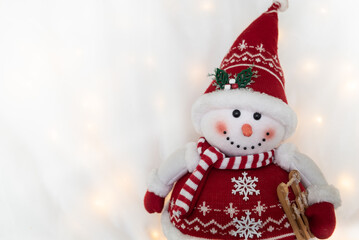 smiling toy snowman on white background