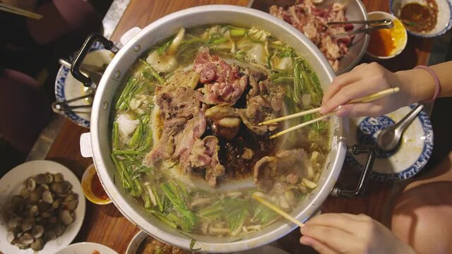 closeup famous asian street food bbg moo kata hot pot party enjoy eating dinner together with fun party and cheerful