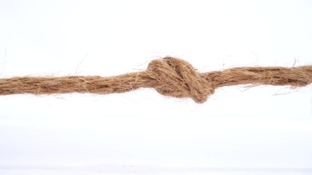 Rope - Pull the knot isolated on white background