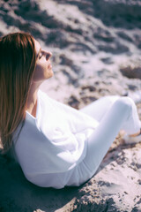 Beautiful fashionable young woman dressed in white sportswear outdoor autumn