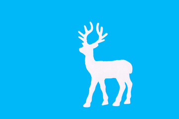 Reindeer silhouette on blue backdrop