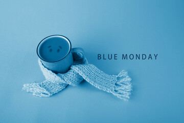Blue cup with scarfcoffee on blue background. Blue monday concept - Powered by Adobe