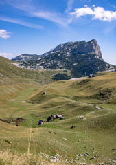 Fantastic mountains of Montenegro. A lonely house among the mountains. Picturesque mountain landscape of Durmitor National Park, Montenegro, Europe, Balkans, Dinaric Alps, UNESCO World Heritage Site.