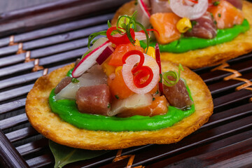 Taco with tuna and salmon