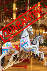 festive merry-go-round carousel with horses and lights in Frankfurt during the Christmas market,...