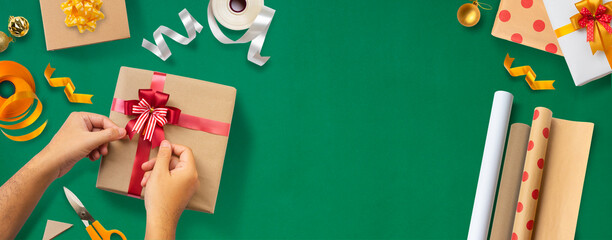 Wrapping Christmas gifts banner with green background 