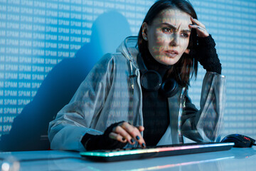Internet, crime, cyber attack, system breaking concept. Blue neon light background. Woman hacker is working on a code with digital interface all around.