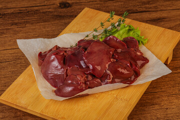 Raw chicken liver over board