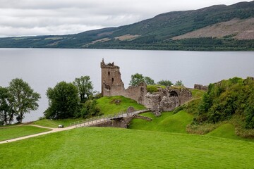 Fototapeta premium Ruins of stone Urquhart Castle on a bank of Loch Ness in the Scotland