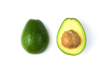 Two halves of an avocado with a stone with traces of oxidation. Top view on a white background. Concept of fruit backgrounds.