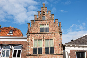 Fototapeta na wymiar Unusual facade of an old Dutch brick building