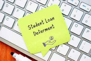 Student Loan Deferment sign on the piece of paper.