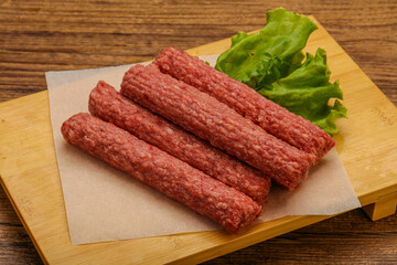 Raw beef sausages with spices